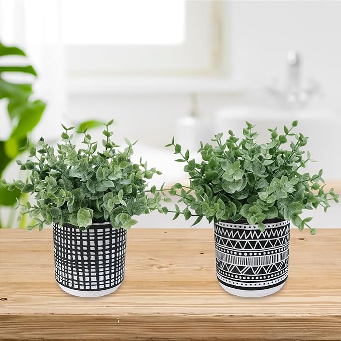 Winlyn Set of 2 Small Potted Plants Artificial Eucalyptus Plant in Black Geometric Ceramic Pots Faux Potted Greenery 7.1" Tall for Desktop Modern Home Office Living Room Kitchen Table Decorations