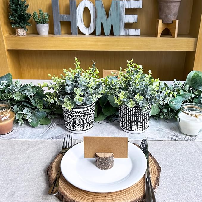 Winlyn Set of 2 Small Potted Plants Artificial Eucalyptus Plant in Black Geometric Ceramic Pots Faux Potted Greenery 7.1" Tall for Desktop Modern Home Office Living Room Kitchen Table Decorations